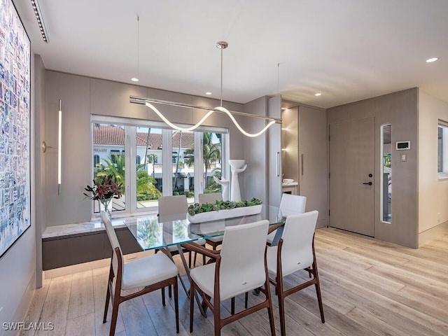 dining area with light wood-type flooring