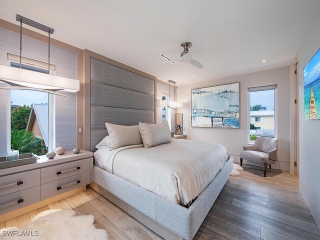 bedroom featuring wood-type flooring and ceiling fan