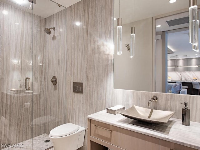 bathroom with toilet, an enclosed shower, tile walls, vanity, and decorative backsplash