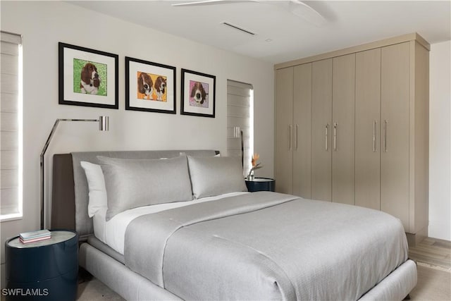 bedroom featuring ceiling fan and light wood-type flooring