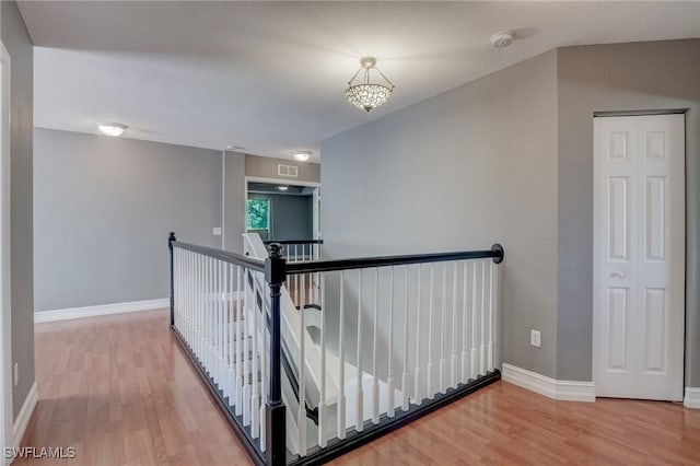 hallway with wood-type flooring