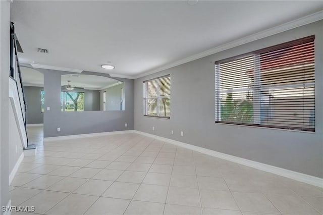 1654 Double Eagle Trl, Naples, FL 34120 - empty room featuring ornamental molding, a ceiling fan, plenty of natural light, light tile patterned flooring, and baseboards