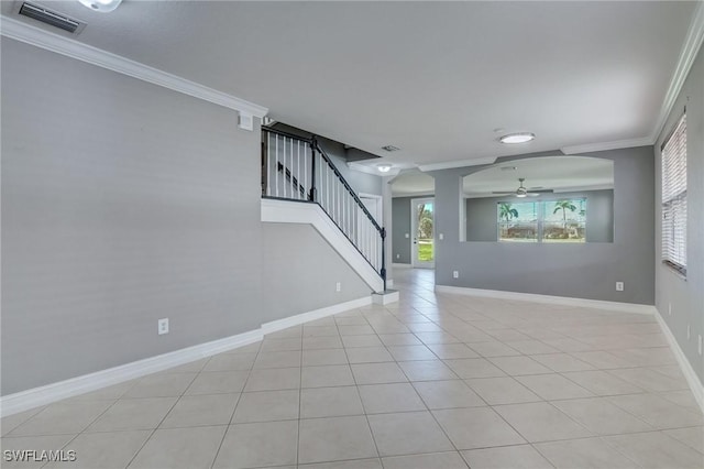 1654 Double Eagle Trl, Naples, FL 34120 - unfurnished living room featuring ornamental molding, stairway, ceiling fan, baseboards, and light tile patterned flooring