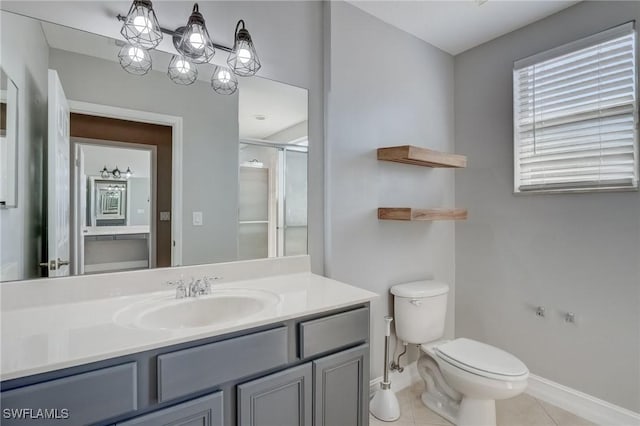 bathroom with toilet, an enclosed shower, vanity, a notable chandelier, and tile patterned flooring