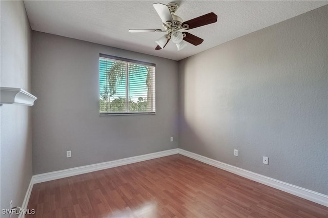 unfurnished room featuring a textured ceiling, wood-type flooring, and ceiling fan