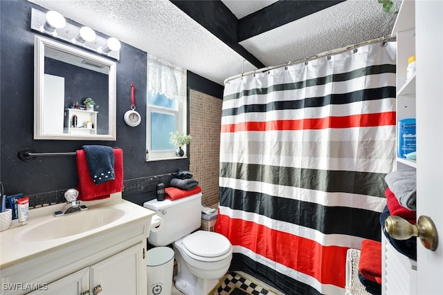 bathroom featuring vanity, walk in shower, a textured ceiling, and toilet