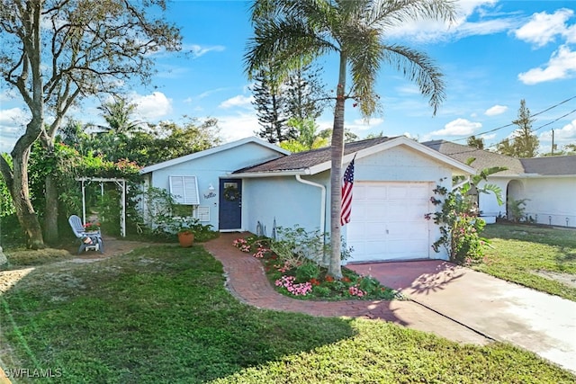 single story home featuring a garage and a front yard