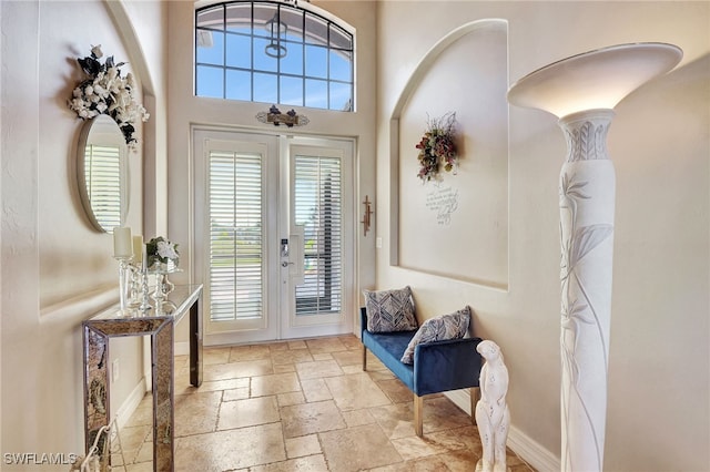 entryway featuring a high ceiling