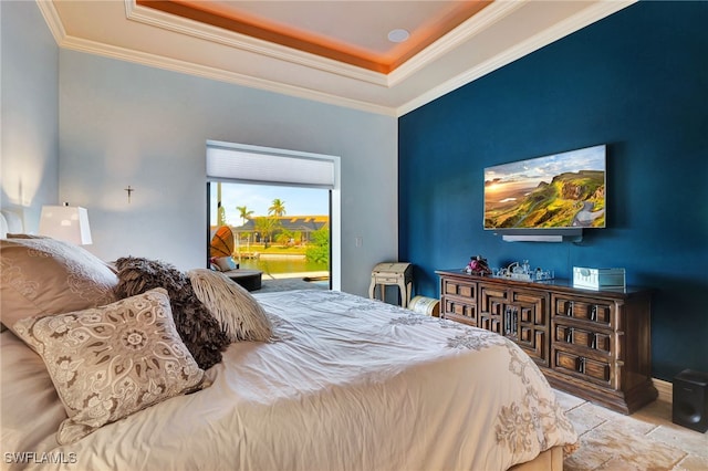 bedroom featuring crown molding and a raised ceiling