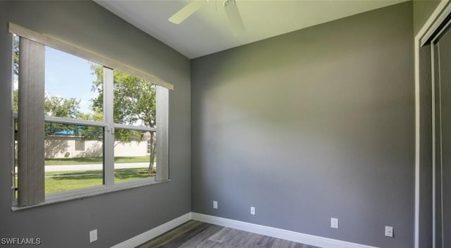 spare room with hardwood / wood-style flooring and ceiling fan