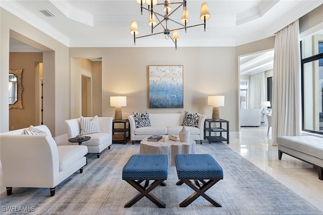 living room featuring an inviting chandelier, ornamental molding, and a raised ceiling