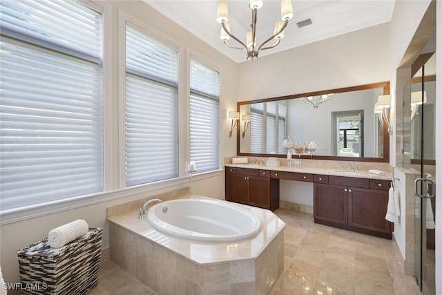 bathroom with an inviting chandelier, vanity, and shower with separate bathtub