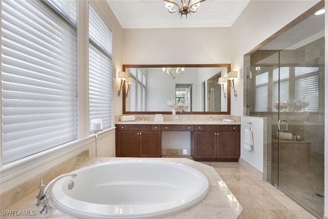 bathroom featuring vanity, a notable chandelier, and shower with separate bathtub