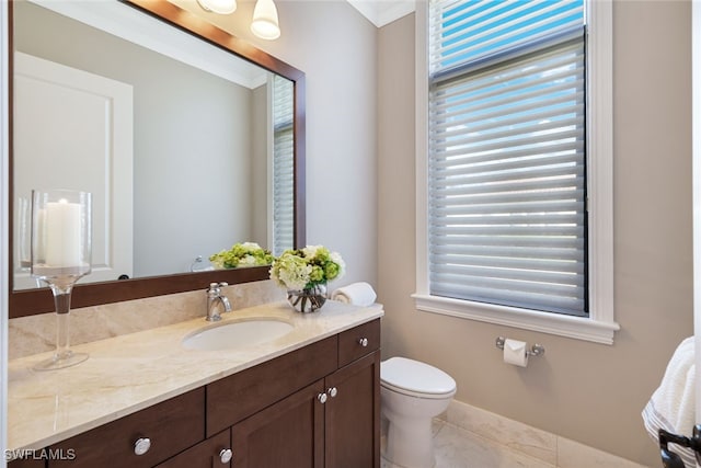 bathroom featuring vanity, tile patterned floors, and toilet