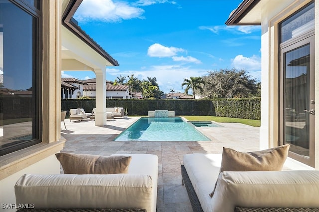 view of pool with an outdoor living space, a patio, and an in ground hot tub