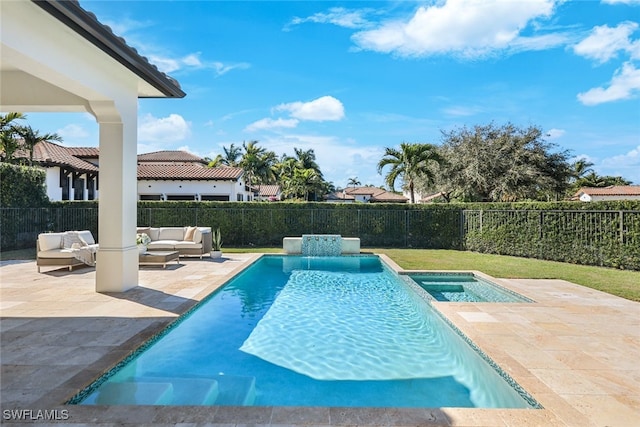 view of swimming pool with an outdoor living space, an in ground hot tub, and a patio area