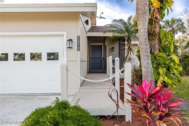 doorway to property featuring a garage