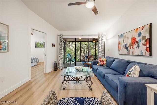 living room featuring ceiling fan and hardwood / wood-style floors