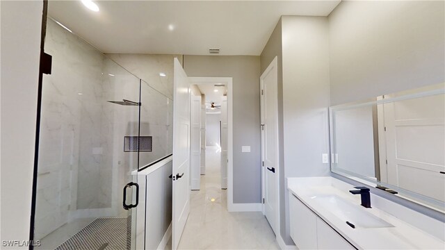 bathroom with walk in shower and vanity