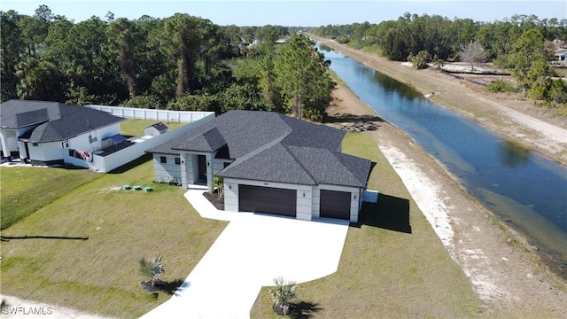 drone / aerial view featuring a water view