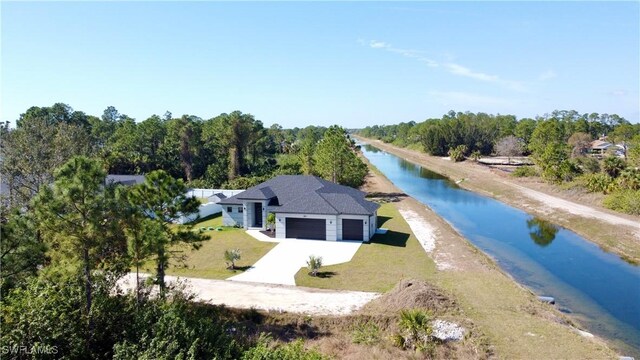 aerial view featuring a water view and a view of the beach