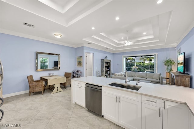 kitchen featuring white cabinetry, dishwasher, sink, and a tray ceiling