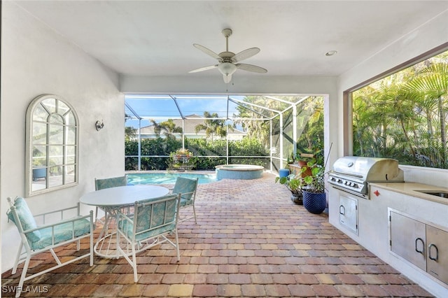 sunroom with ceiling fan