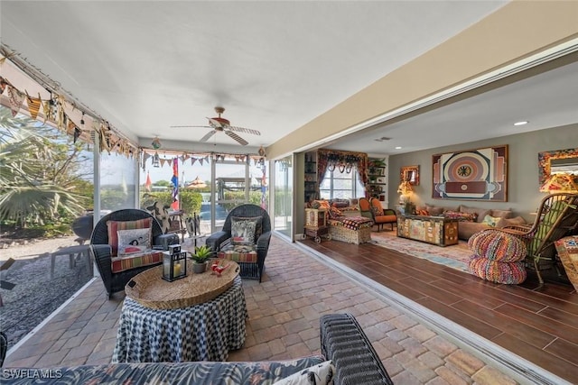 sunroom / solarium with ceiling fan