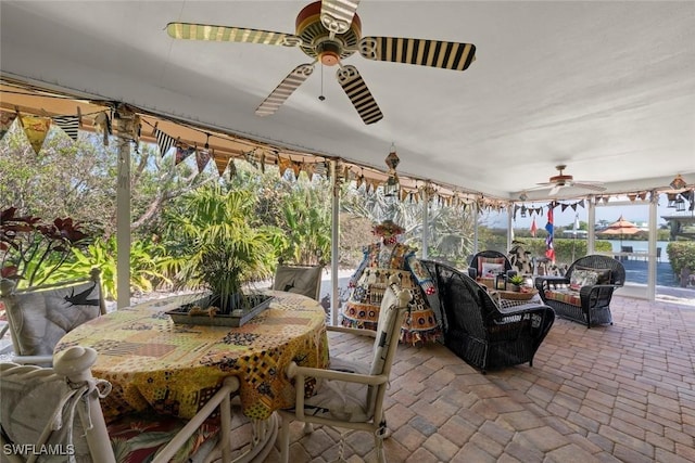 sunroom / solarium with ceiling fan