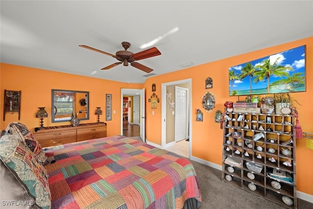 carpeted bedroom featuring ceiling fan