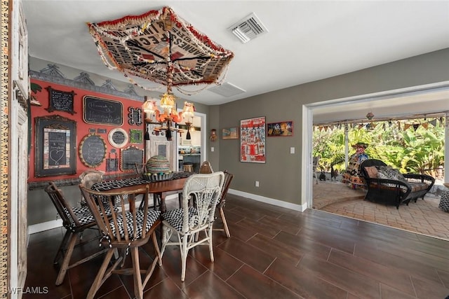 dining area with a notable chandelier