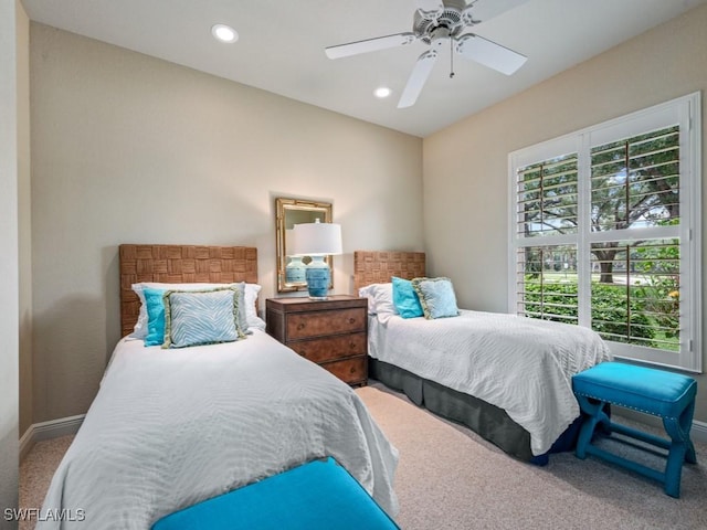 carpeted bedroom featuring ceiling fan