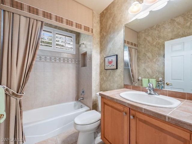 full bathroom featuring tile patterned flooring, vanity, shower / tub combo with curtain, and toilet