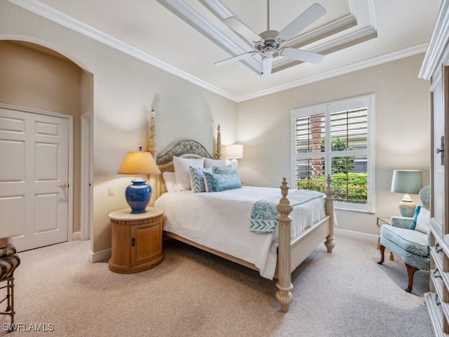 carpeted bedroom featuring crown molding and ceiling fan