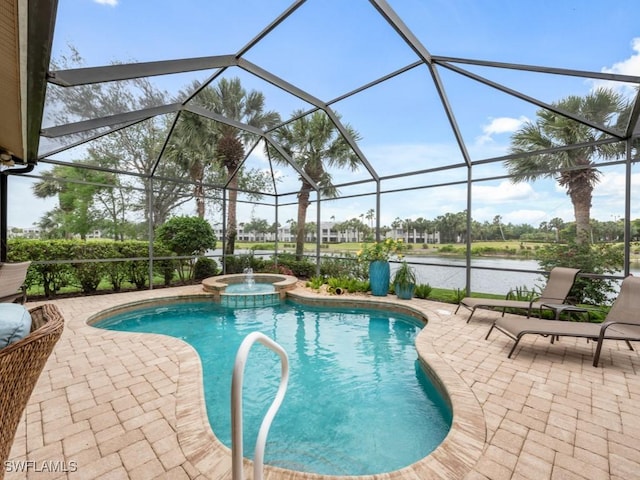 view of swimming pool featuring a patio, a water view, an in ground hot tub, and glass enclosure