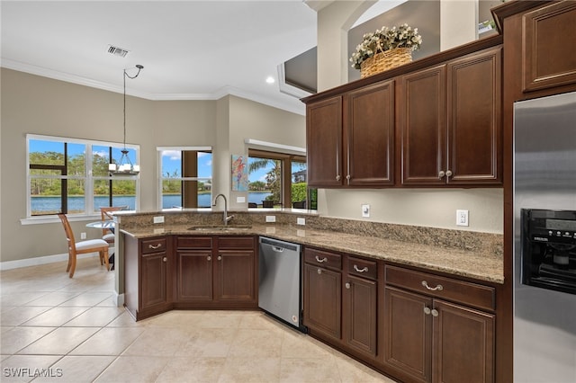 kitchen featuring sink, crown molding, stainless steel appliances, a water view, and dark stone counters