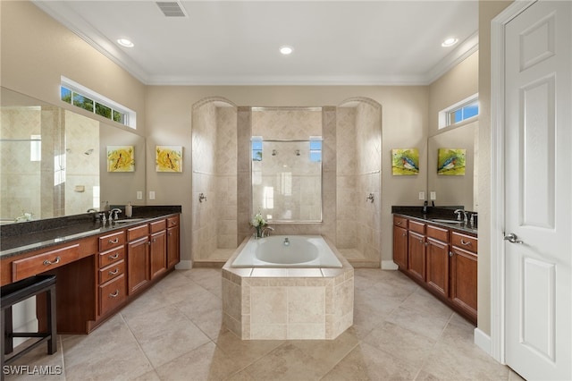 bathroom featuring ornamental molding, separate shower and tub, and vanity