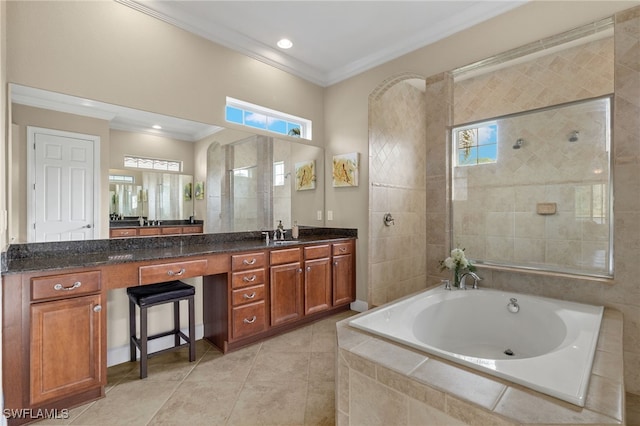 bathroom with vanity, crown molding, tile patterned floors, and plus walk in shower