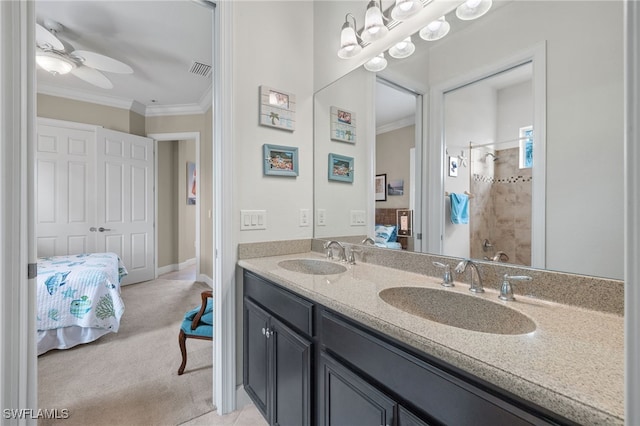 bathroom featuring vanity, ornamental molding, ceiling fan, and walk in shower