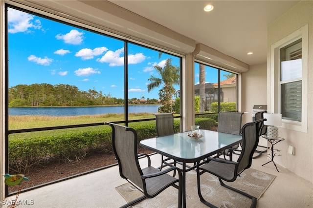 sunroom with a water view