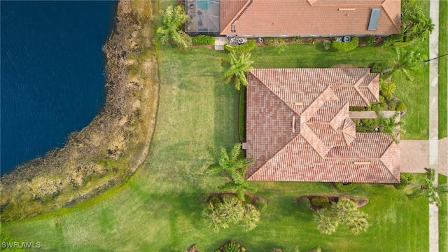 birds eye view of property with a water view