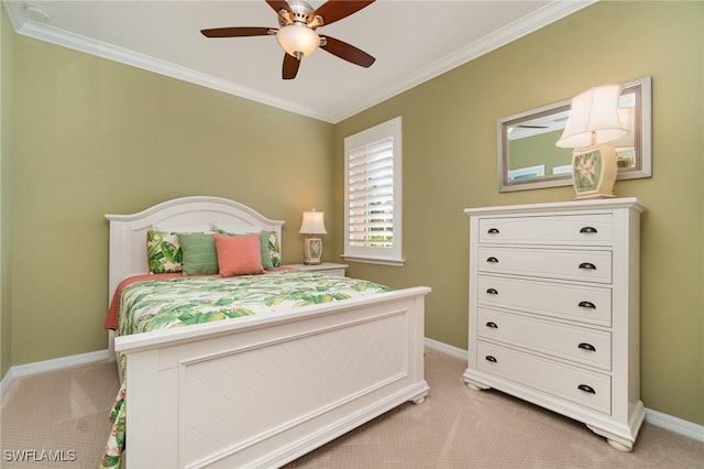 bedroom featuring crown molding, light colored carpet, and ceiling fan