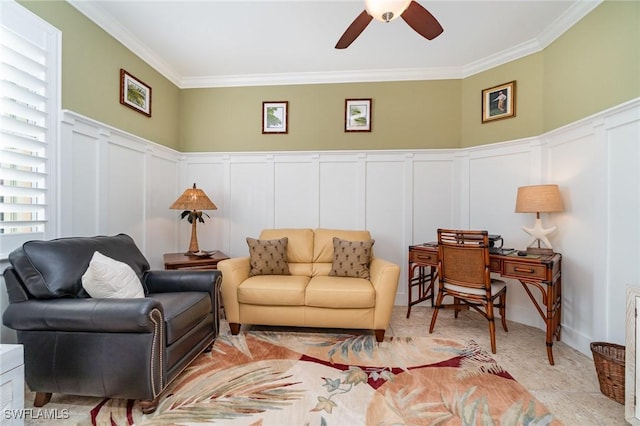 living room featuring ceiling fan and ornamental molding