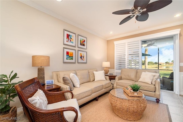 living room featuring crown molding, light tile patterned flooring, and ceiling fan