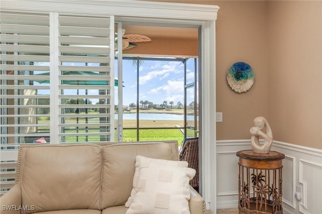 sunroom / solarium with a water view