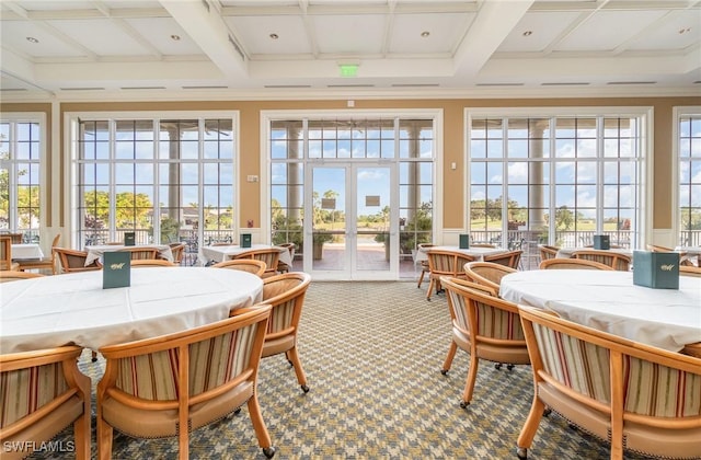 sunroom featuring french doors, coffered ceiling, and beamed ceiling