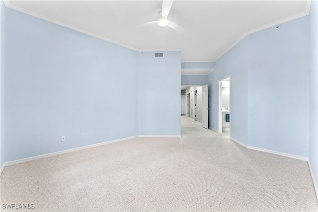 unfurnished room featuring ceiling fan, light carpet, visible vents, baseboards, and crown molding