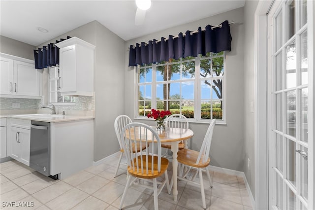 dining room featuring baseboards and light tile patterned floors