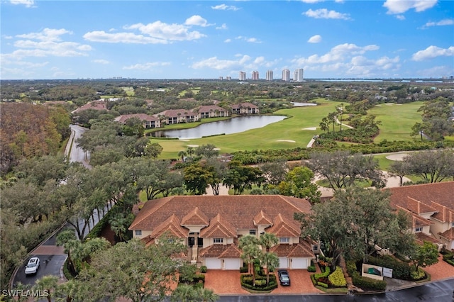 drone / aerial view featuring a water view and golf course view