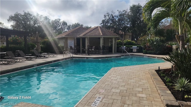 community pool featuring a patio area and a gazebo